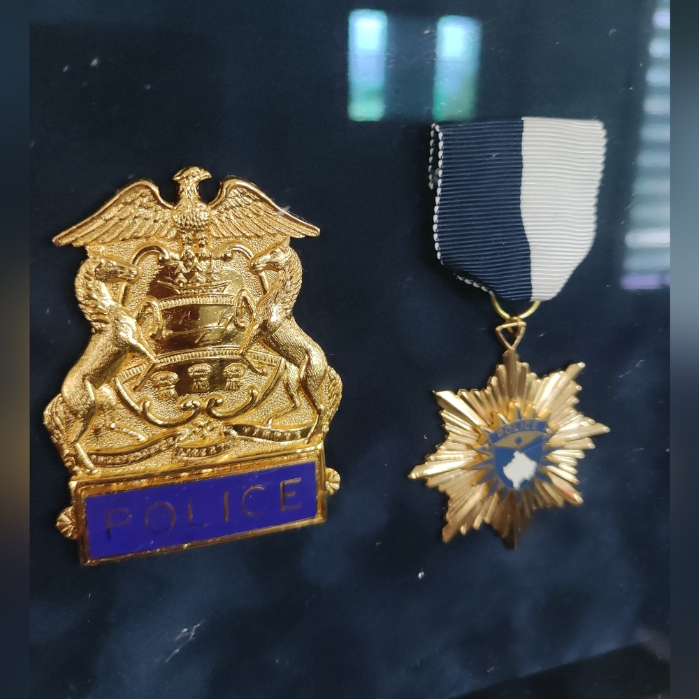 Movie Prop Police badge and medal framed